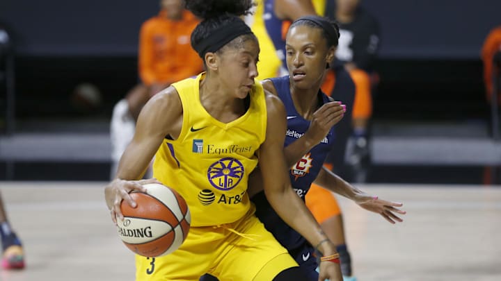 Sep 17, 2020; Palmetto, Florida, USA: Los Angeles Sparks forward Candace Parker (3) drives past Connecticut Sun forward DeWanna Bonner (24) during the first half at the FELD entertainment complex. Mandatory Credit: Reinhold Matay-Imagn Images