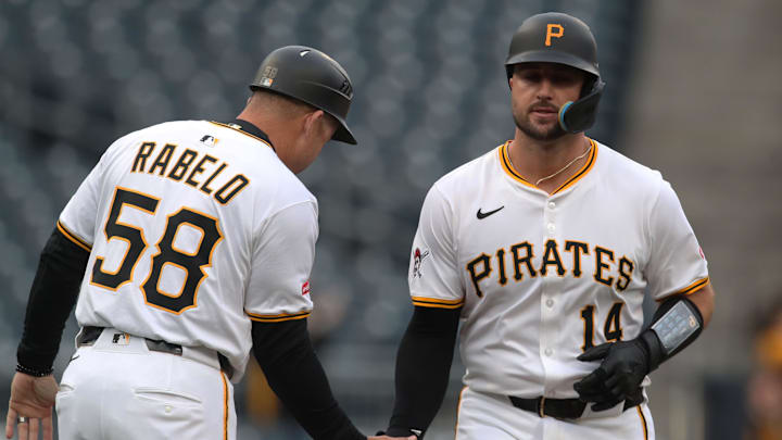 Apr 7, 2025; Pittsburgh, Pennsylvania, USA;  Pittsburgh Pirates third base coach Mike Rabelo (58) congratulates catcher Joey Bart (14) as he circles the bases on a solo home run against the St. Louis Cardinals during the first inning at PNC Park. Mandatory Credit: Charles LeClaire-Imagn Images