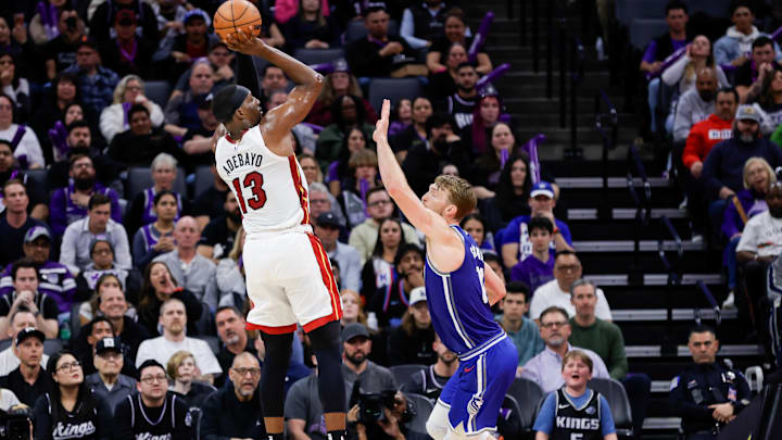 Feb 26, 2024; Sacramento, California, USA; Miami Heat center Bam Adebayo (13) shoots the ball over Sacramento Kings forward Domantas Sabonis (10) during the fourth quarter at Golden 1 Center. Mandatory Credit: Sergio Estrada-Imagn Images Feb 26, 2024; Sacramento, California, USA; Miami Heat center Bam Adebayo (13) shoots the ball over Sacramento Kings forward Domantas Sabonis (10) during the fourth quarter at Golden 1 Center. Mandatory Credit: Sergio Estrada-Imagn Images