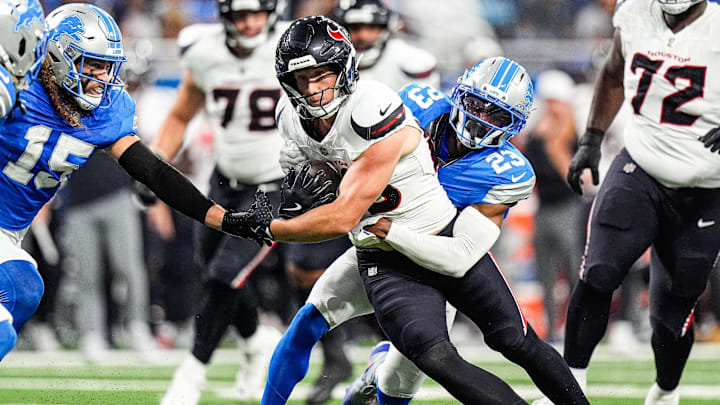 Detroit Lions cornerback Rock Ya-Sin (23) tackles Houston Texans tight end Harrison Bryant (88) during the first half at Ford Field in Detroit on Saturday, August 23, 2025.