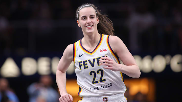 May 22, 2025; Atlanta, Georgia, USA; Indiana Fever guard Caitlin Clark (22) reacts after a basket against the Atlanta Dream in the first half at State Farm Arena. Mandatory Credit: Brett Davis-Imagn Images