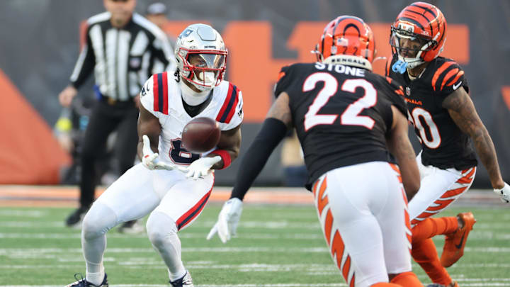 Nov 23, 2025; Cincinnati, Ohio, USA; New England Patriots wide receiver Stefon Diggs (8) makes a catch against Cincinnati Bengals cornerback DJ Turner II (20) during the second half at Paycor Stadium. Mandatory Credit: Joseph Maiorana-Imagn Images