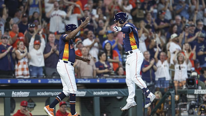 Sep 22, 2024; Houston, Texas, USA; Houston Astros third baseman Alex Bregman (2) celebrates with third base coach Gary Pettis (8) after hitting a home run during the fifth inning against the Los Angeles Angels at Minute Maid Park.