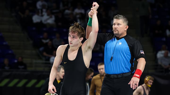 Mar 8, 2026; University Park, PA, USA; Iowa Hawkeyes wrestler Drake Ayala has his arm raised after defeating Illinois Fighting Illini wrestler Lucas Byrd (not pictured) in a 133-pound bout during a consolation semifinal of the Big Ten Wrestling Championships at Bryce Jordan Center. Mandatory Credit: Matthew O'Haren-Imagn Images