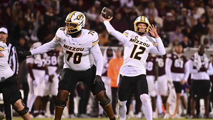 Nov 23, 2024; Starkville, Mississippi, USA; Missouri Tigers quarterback Brady Cook (12) throws against the Mississippi State Bulldogs during the third quarter at Davis Wade Stadium at Scott Field. Mandatory Credit: Matt Bush-Imagn Images