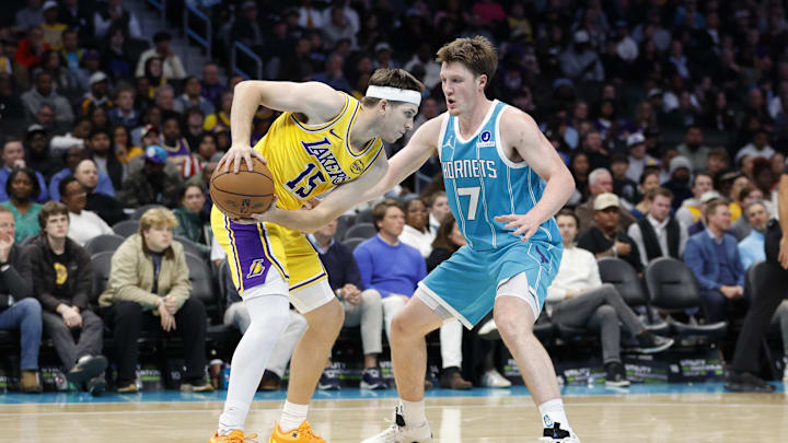 Nov 10, 2025; Charlotte, North Carolina, USA; Los Angeles Lakers guard Austin Reaves (15) is guarded by Charlotte Hornets guard/forward Kon Knueppel (7) during the second half at Spectrum Center. Mandatory Credit: Brian Westerholt-Imagn Images Nov 10, 2025; Charlotte, North Carolina, USA; Los Angeles Lakers guard Austin Reaves (15) is guarded by Charlotte Hornets guard/forward Kon Knueppel (7) during the second half at Spectrum Center. Mandatory Credit: Brian Westerholt-Imagn Images