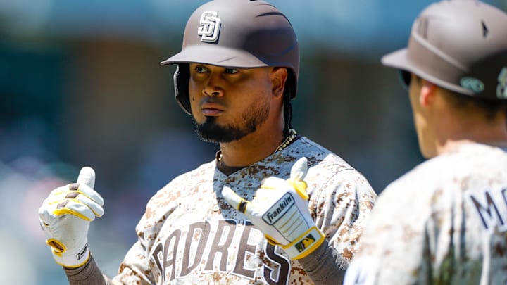 Apr 13, 2025; San Diego, California, USA; San Diego Padres designated hitter Luis Arraez (4) celebrates after hitting a single during the first inning against the Colorado Rockies at Petco Park. Mandatory Credit: David Frerker-Imagn Images