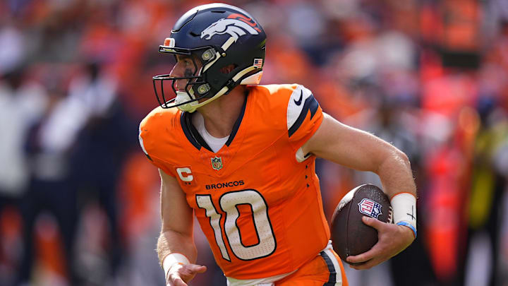 Sep 7, 2025; Denver, Colorado, USA; Denver Broncos quarterback Bo Nix (10) rushes the ball against the Tennessee Titans in the second half at Empower Field at Mile High. Sep 7, 2025; Denver, Colorado, USA; Denver Broncos quarterback Bo Nix (10) rushes the ball against the Tennessee Titans in the second half at Empower Field at Mile High.