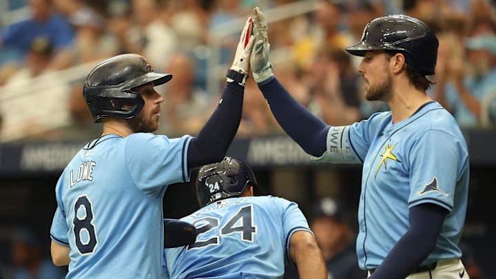 Outfielder Josh Lowe (right ) returns to the lineup on Thursday for the Tampa Bay Rays. He's been out with an oblique injury since Opening Day. 