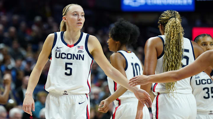 Dec 3, 2024; Storrs, Connecticut, USA; UConn Huskies guard Paige Bueckers (5) reacts during a break against the Holy Cross Crusaders in the first half at Harry A. Gampel Pavilion. Mandatory Credit: David Butler II-Imagn Images Dec 3, 2024; Storrs, Connecticut, USA; UConn Huskies guard Paige Bueckers (5) reacts during a break against the Holy Cross Crusaders in the first half at Harry A. Gampel Pavilion. Mandatory Credit: David Butler II-Imagn Images