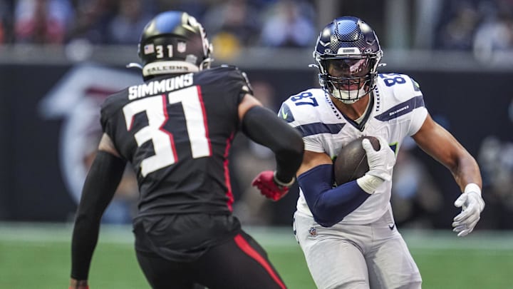 Oct 20, 2024; Atlanta, Georgia, USA; Seattle Seahawks tight end Noah Fant (87) runs against Atlanta Falcons safety Justin Simmons (31) during the first half at Mercedes-Benz Stadium. Mandatory Credit: Dale Zanine-Imagn Images