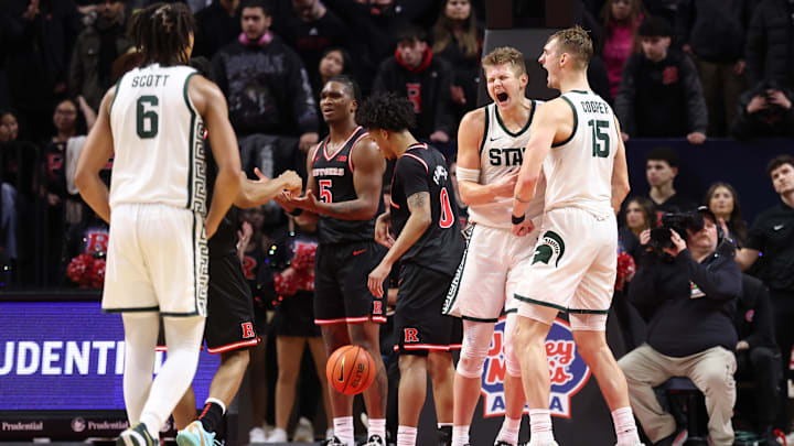 Jan 27, 2026; Piscataway, New Jersey, USA; Michigan State Spartans forward Jaxon Kohler (0) reacts with center Carson Cooper (15) after scoring a basket during overtime against the Rutgers Scarlet Knights at Jersey Mike's Arena. Mandatory Credit: Vincent Carchietta-Imagn Images