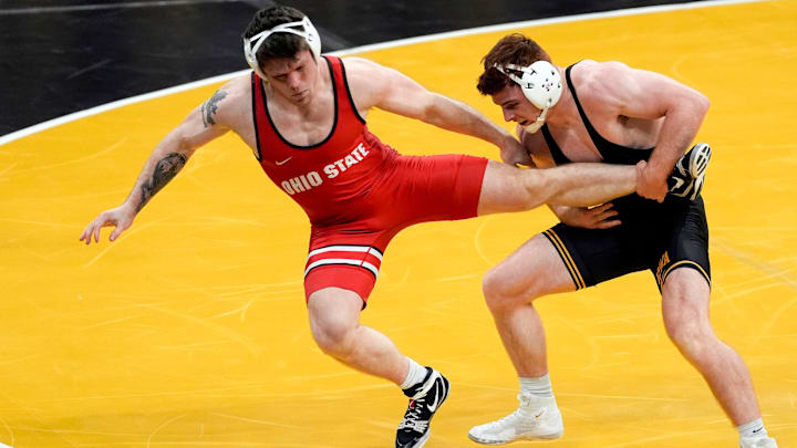 Iowa’s Michael Caliendo attempts a single-leg takedown on Ohio State’s Paddy Callagher in a 165-pound match during a Big Ten conference dual Saturday, Jan. 25, 2025 at Carver-Hawkeye Arena in Iowa City, Iowa.