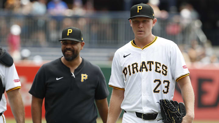 Jul 8, 2024; Pittsburgh, Pennsylvania, USA;  Pittsburgh Pirates pitching coach Oscar Marin (47) and starting pitcher Mitch Keller (23) walk in from the bullpen to play the New York Mets at PNC Park. Mandatory Credit: Charles LeClaire-Imagn Images