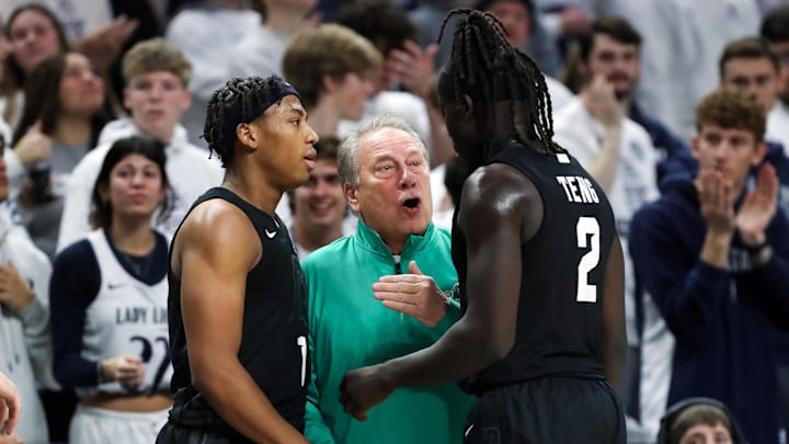 Dec 13, 2025; University Park, Pennsylvania, USA; Michigan State Spartans head coach Tom Izzo talks with guard Jeremy Fears Jr (1) and guard Kur Teng (2) during the second half against the Penn State Nittany Lions at Bryce Jordan Center. Mandatory Credit: Matthew O'Haren-Imagn Images