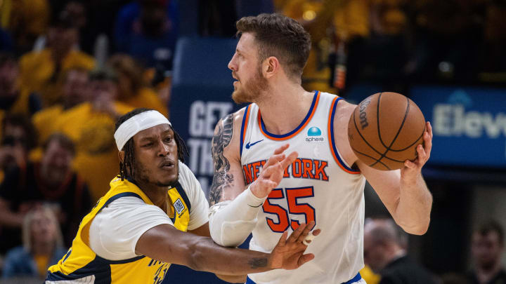 May 17, 2024; Indianapolis, Indiana, USA; New York Knicks center Isaiah Hartenstein (55) holds the ball while Indiana Pacers center Myles Turner (33) defends during game six of the second round for the 2024 NBA playoffs at Gainbridge Fieldhouse. Mandatory Credit: Trevor Ruszkowski-USA TODAY Sports May 17, 2024; Indianapolis, Indiana, USA; New York Knicks center Isaiah Hartenstein (55) holds the ball while Indiana Pacers center Myles Turner (33) defends during game six of the second round for the 2024 NBA playoffs at Gainbridge Fieldhouse. Mandatory Credit: Trevor Ruszkowski-USA TODAY Sports