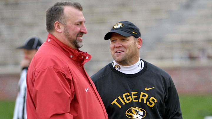 Arkansas Razorbacks head coach Bret Bielema talks with Missouri Tigers head coach Barry Odom Arkansas Razorbacks head coach Bret Bielema talks with Missouri Tigers head coach Barry Odom