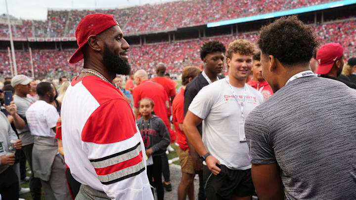 LeBron James talks to recruits prior to the NCAA football game between the Ohio State Buckeyes and Notre Dame Fighting Irish at Ohio Stadium. LeBron James talks to recruits prior to the NCAA football game between the Ohio State Buckeyes and Notre Dame Fighting Irish at Ohio Stadium.