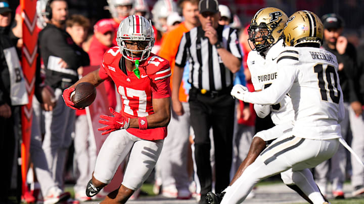 Ohio State Buckeyes wide receiver Carnell Tate (17) runs the ball