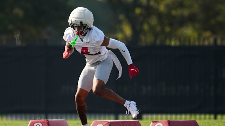 Ohio State Buckeyes cornerback Devin Sanchez (4) runs a drill during football training camp at the Woody Hayes Athletic Center on Aug. 1, 2025. Ohio State Buckeyes cornerback Devin Sanchez (4) runs a drill during football training camp at the Woody Hayes Athletic Center on Aug. 1, 2025.