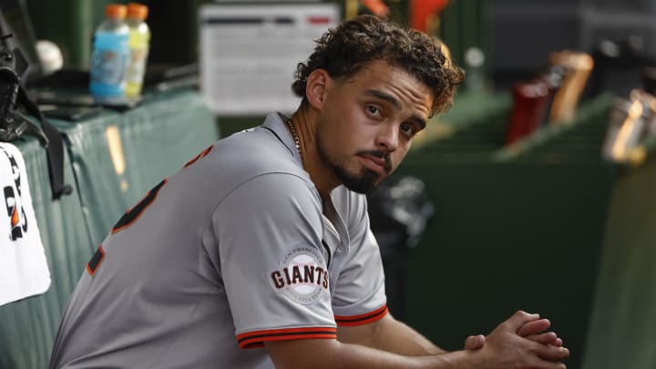Jun 17, 2024; Chicago, Illinois, USA; San Francisco Giants starting pitcher Jordan Hicks (12) sits in the dugout during the third inning of a baseball game against the Chicago Cubs at Wrigley Field. Jun 17, 2024; Chicago, Illinois, USA; San Francisco Giants starting pitcher Jordan Hicks (12) sits in the dugout during the third inning of a baseball game against the Chicago Cubs at Wrigley Field.