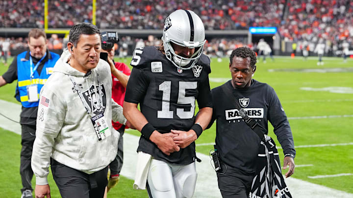 Nov 24, 2024; Paradise, Nevada, USA; Las Vegas Raiders quarterback Gardner Minshew (15) heads for the locker room after sustaining an apparent injury during a play against the Denver Broncos during the fourth quarter at Allegiant Stadium. Mandatory Credit: Stephen R. Sylvanie-Imagn Images
