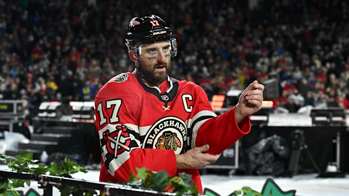Dec 31, 2024; Chicago, Illinois, USA; Chicago Blackhawks left wing Nick Foligno (17) leaves the rink after a fight during the second period in the Winter Classic against the St. Louis Blues at Wrigley Field. Mandatory Credit: Daniel Bartel-Imagn Images