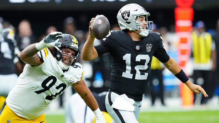 Oct 13, 2024; Paradise, Nevada, USA; Las Vegas Raiders quarterback Aidan O'Connell (12) is flushed from the pocket by Pittsburgh Steelers defensive tackle Isaiahh Loudermilk (92) during the second quarter at Allegiant Stadium. Mandatory Credit: Stephen R. Sylvanie-Imagn Images