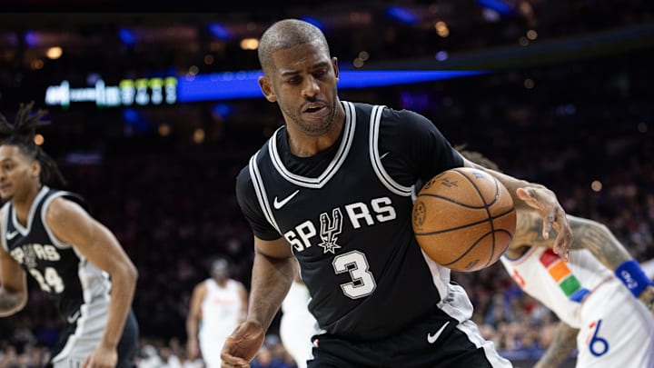 Dec 23, 2024; Philadelphia, Pennsylvania, USA; San Antonio Spurs guard Chris Paul (3) controls a loose ball against the Philadelphia 76ers during the second quarter at Wells Fargo Center. Mandatory Credit: Bill Streicher-Imagn Images
