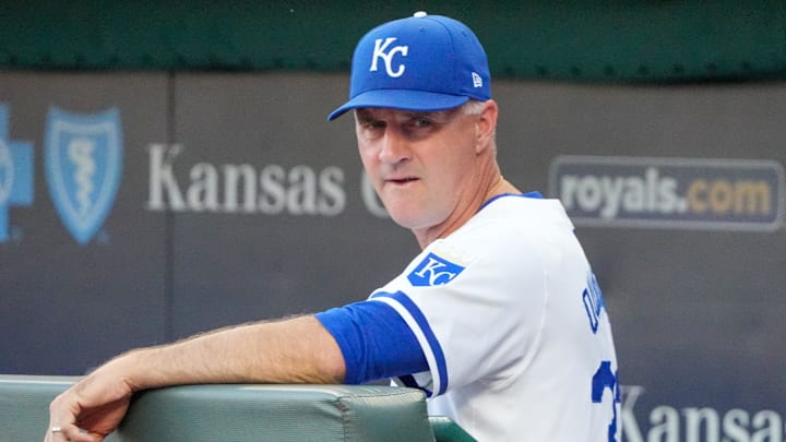 Sep 4, 2024; Kansas City, Missouri, USA; Kansas City Royals manager Matt Quatraro (33) watches from the dugout against the Cleveland Guardians prior to a game at Kauffman Stadium. Mandatory Credit: Denny Medley-Imagn Images