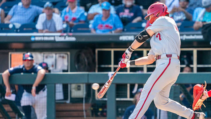 Jun 23, 2022; Omaha, NE, USA; Arkansas Razorbacks third baseman Cayden Wallace (7) lines out to right field to end the sixth inning against the Ole Miss Rebels at Charles Schwab Field. Jun 23, 2022; Omaha, NE, USA; Arkansas Razorbacks third baseman Cayden Wallace (7) lines out to right field to end the sixth inning against the Ole Miss Rebels at Charles Schwab Field.