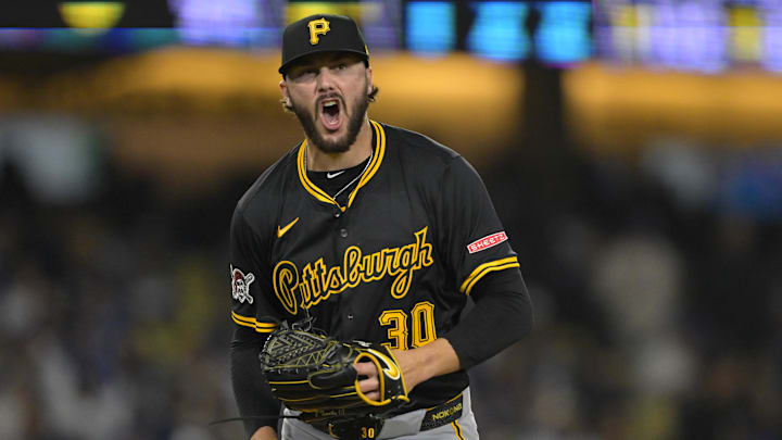 Apr 25, 2025; Los Angeles, California, USA;  Pittsburgh Pirates starting pitcher Paul Skenes (30) reacts after striking out Los Angeles Dodgers second baseman Tommy Edman (25) to end the sixth inning at Dodger Stadium. Mandatory Credit: Jayne Kamin-Oncea-Imagn Images