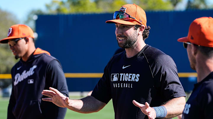 Detroit Tigers outfielder Matt Vierling, center, talks to teammates during spring training at TigerTown in Lakeland, Fla. on Monday, Feb. 17, 2025.