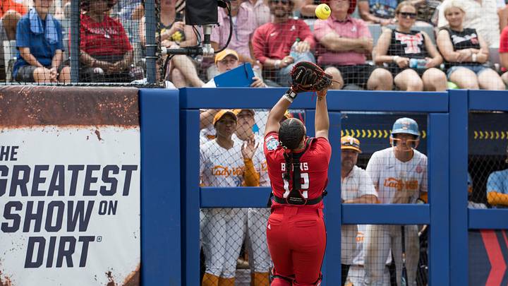 May 30, 2026; Oklahoma City, OK, USA; Texas Tech Red Raiders catcher Jasmyn Burns (12) makes a catch for an out in the third inning against the Tennessee Lady Volunteers during the NCAA Women’s College World Series at Devon Park. Mandatory Credit: Brett Rojo-Imagn Images May 30, 2026; Oklahoma City, OK, USA; Texas Tech Red Raiders catcher Jasmyn Burns (12) makes a catch for an out in the third inning against the Tennessee Lady Volunteers during the NCAA Women’s College World Series at Devon Park. Mandatory Credit: Brett Rojo-Imagn Images
