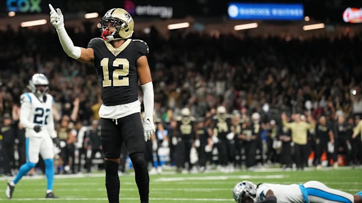 Dec 14, 2025; New Orleans, Louisiana, USA; New Orleans Saints wide receiver Chris Olave (12) reacts after scoring a touchdown in the fourth quarter against the Carolina Panthers at Caesars Superdome. Mandatory Credit: Matthew Hinton-Imagn Images Dec 14, 2025; New Orleans, Louisiana, USA; New Orleans Saints wide receiver Chris Olave (12) reacts after scoring a touchdown in the fourth quarter against the Carolina Panthers at Caesars Superdome. Mandatory Credit: Matthew Hinton-Imagn Images