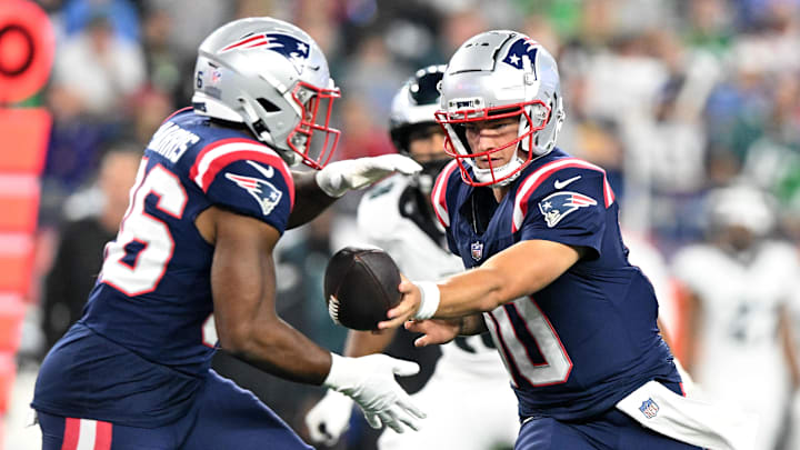 Aug 15, 2024; Foxborough, Massachusetts, USA; New England Patriots quarterback Drake Maye (10) hands the ball off to running back Kevin Harris (36) during the second half at Gillette Stadium. Mandatory Credit: Brian Fluharty-Imagn Images