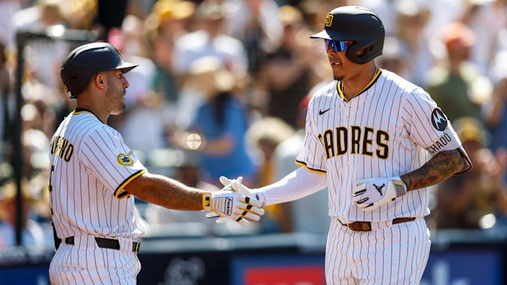 Sep 3, 2025; San Diego, California, USA; San Diego Padres third baseman Manny Machado (13) celebrates with left fielder Ramon Laureano (5) after hitting a two-run home run during the sixth inning against the Baltimore Orioles at Petco Park. Mandatory Credit: David Frerker-Imagn Images