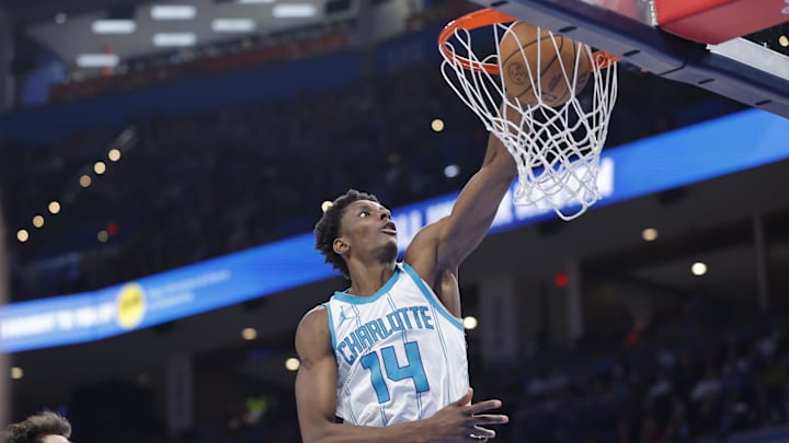 Mar 21, 2025; Oklahoma City, Oklahoma, USA; Charlotte Hornets forward Moussa Diabate (14) dunks against the Oklahoma City Thunder during the second half at Paycom Center. Mandatory Credit: Alonzo Adams-Imagn Images