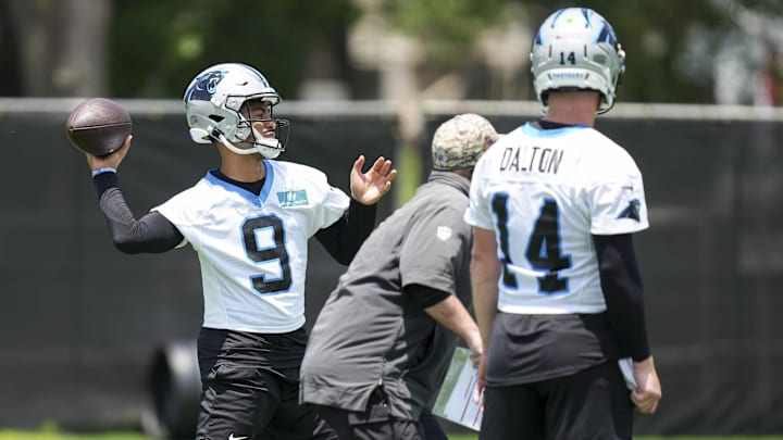 Jun 11, 2025; Charlotte, NC, USA; Carolina Panthers quarterback Andy Dalton (14) watches quarterback Bryce Young (9) throw during minicamp at Bank of America Stadium. Mandatory Credit: Jim Dedmon-Imagn Images Jun 11, 2025; Charlotte, NC, USA; Carolina Panthers quarterback Andy Dalton (14) watches quarterback Bryce Young (9) throw during minicamp at Bank of America Stadium. Mandatory Credit: Jim Dedmon-Imagn Images