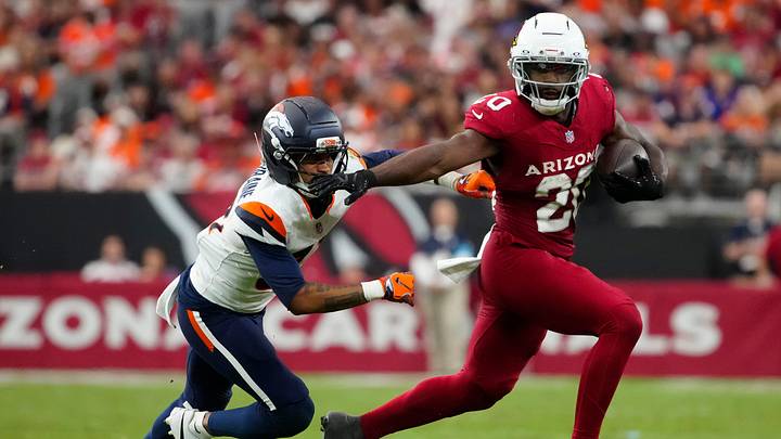 Arizona Cardinals running back Bam Knight (20) stiff arms Denver Broncos defensive back Kris Abrams-Draine (31) during a game at State Farm Stadium in Glendale, Ariz. on Oct. 24, 2026. Arizona Cardinals running back Bam Knight (20) stiff arms Denver Broncos defensive back Kris Abrams-Draine (31) during a game at State Farm Stadium in Glendale, Ariz. on Oct. 24, 2026.