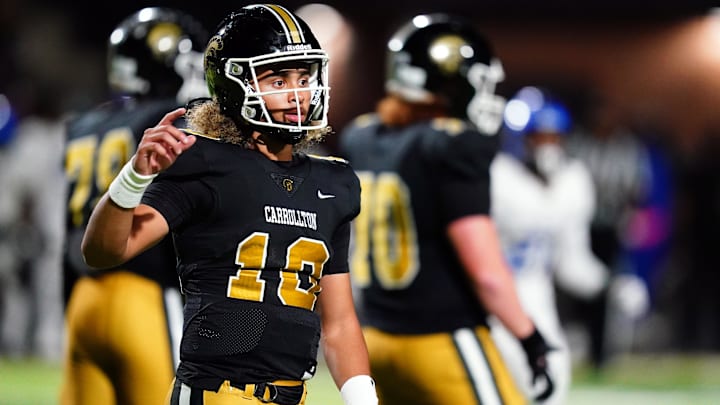 Oct 20, 2023; Carrollton, GA, USA; Carrollton Trojans quarterback Julian Lewis (10) looks for the