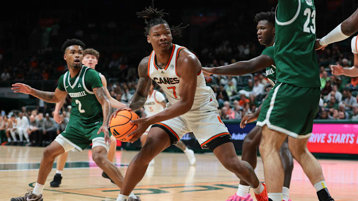 Nov 3, 2025; Coral Gables, Florida, USA; Miami Hurricanes forward Shelton Henderson (7) drives to the basket against the Jacksonville Dolphins during the first half at Watsco Center.