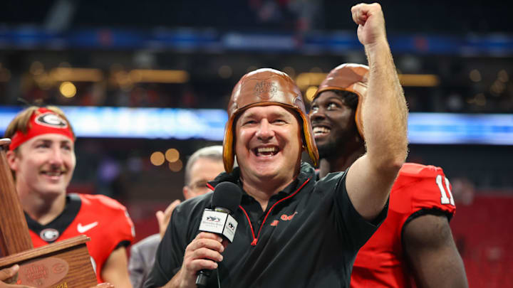Aug 31, 2024; Atlanta, Georgia, USA; Georgia Bulldogs head coach Kirby Smart wears the old leather helmet after a victory over the Clemson Tigers at Mercedes-Benz Stadium. Mandatory Credit: Brett Davis-Imagn Images