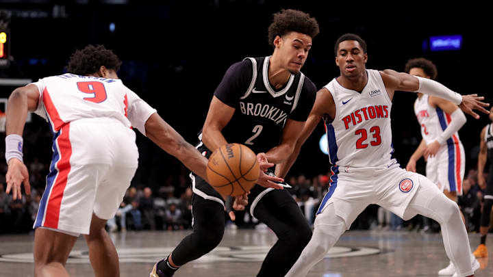 Dec 23, 2023; Brooklyn, New York, USA; Detroit Pistons forward Ausar Thompson (9) knocks the ball away from Brooklyn Nets forward Cameron Johnson (2) as he drives to the basket against Pistons guard Jaden Ivey (23): Brad Penner-Imagn Images