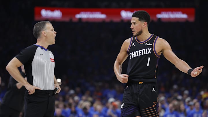Apr 19, 2026; Oklahoma City, Oklahoma, USA; Phoenix Suns guard Devin Booker (1) talks to an official during a break in play against the Oklahoma City Thunder in the second quarter during game one of the first round of the 2026 NBA Playoffs at Paycom Center. Mandatory Credit: Alonzo Adams-Imagn Images