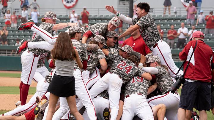 Jun 8, 2026; Tuscaloosa, AL, USA; The Crimson Tide players and coaches celebrate their 7-2 win over St. John’s to earn a trip to the College World Series. Jun 8, 2026; Tuscaloosa, AL, USA; The Crimson Tide players and coaches celebrate their 7-2 win over St. John’s to earn a trip to the College World Series.