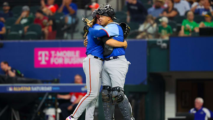 Jul 13, 2024; Arlington, TX, USA; National League Future  pitcher Bubba Chandler (l) hugs National League Future catcher Thayron Liranzo (r) after the game against the American League Future team during the Major league All-Star Futures game at Globe Life Field.  