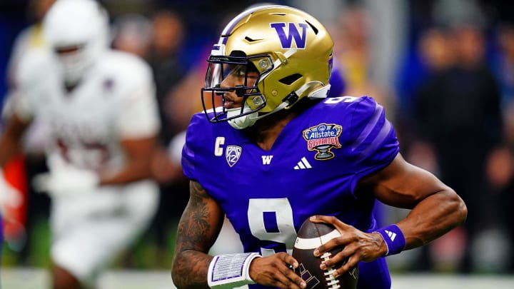 Jan 1, 2024; New Orleans, LA, USA; Washington Huskies quarterback Michael Penix Jr. (9) runs the Jan 1, 2024; New Orleans, LA, USA; Washington Huskies quarterback Michael Penix Jr. (9) runs the