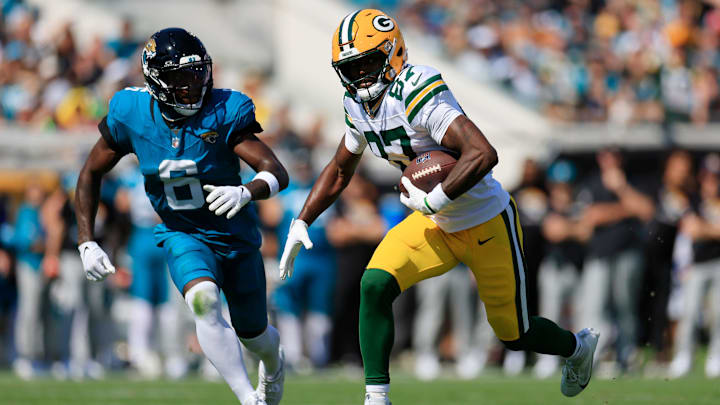 Green Bay Packers wide receiver Romeo Doubs (87) rushes for yards against Jacksonville Jaguars safety Darnell Savage (6) during the first quarter of an NFL football matchup Sunday, Oct. 27, 2024 at EverBank Stadium in Jacksonville, Fla. The Packers edged the Jaguars 30-27 on a last-second field goal. [Corey Perrine/Florida Times-Union]