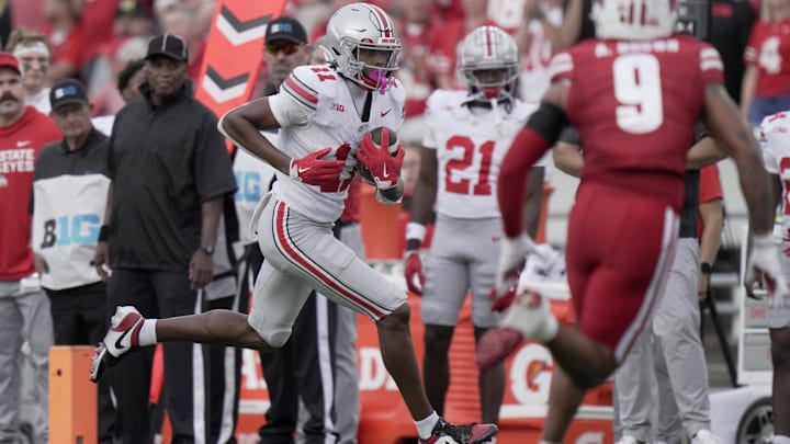 Oct 18, 2025; Madison, Wisconsin, USA; Ohio State wide receiver Quincy Porter (11) makes a reception during the third quarter of their game against Wisconsin at Camp Randall Stadium. Mandatory Credit: Mark Hoffman-USA TODAY Network via Imagn Images Oct 18, 2025; Madison, Wisconsin, USA; Ohio State wide receiver Quincy Porter (11) makes a reception during the third quarter of their game against Wisconsin at Camp Randall Stadium. Mandatory Credit: Mark Hoffman-USA TODAY Network via Imagn Images